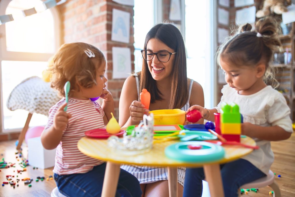 teacher with kids at table